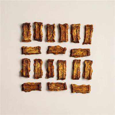 Alaskan Salmon Chips dog treats made from wild caught sustainable salmon pieces arranged in rows