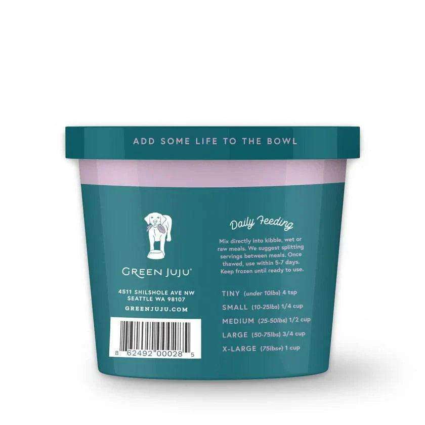 Frozen vegetable blend in a teal resealable tub with a pink band, featuring Green Juju branding and feeding directions; Bailey’s Blend.