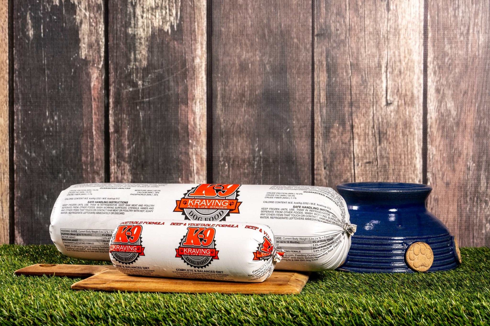 K-9 Kraving Beef & Vegetable Formula Raw Dog Food packaging on wooden board with bowl.