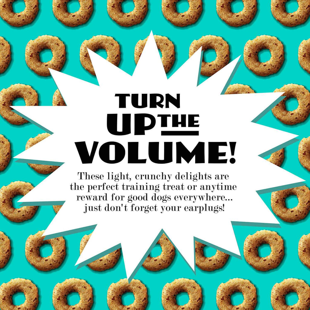 Banana Kablammas dog treats with explosive crunch and banana flavor on teal background, ideal for training and all dog breeds.