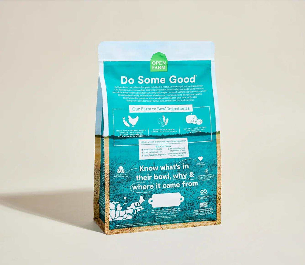 Puppy kibble bag in teal and tan packaging, labeled Open Farm, for Ancient Grains High-Protein Puppy Food