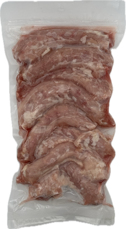 Raw chicken necks in a clear vacuum-sealed package for dogs.