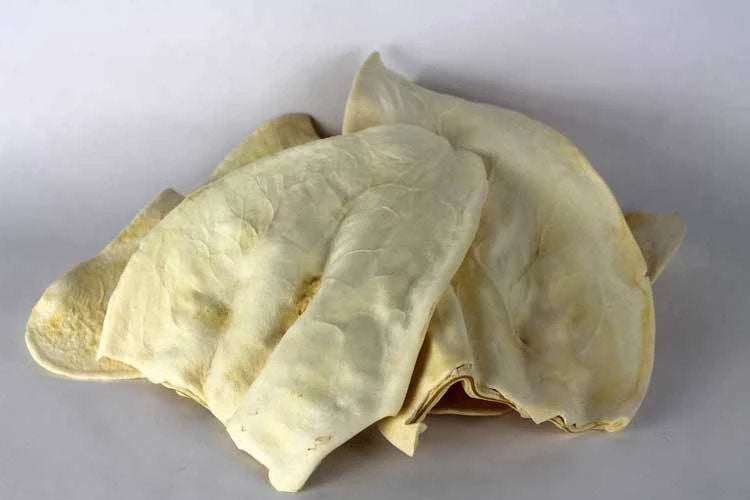 Dried natural cow ears dog chews made from 100% South American Brahman cattle ears, soft and moderately lasting treats for dogs.