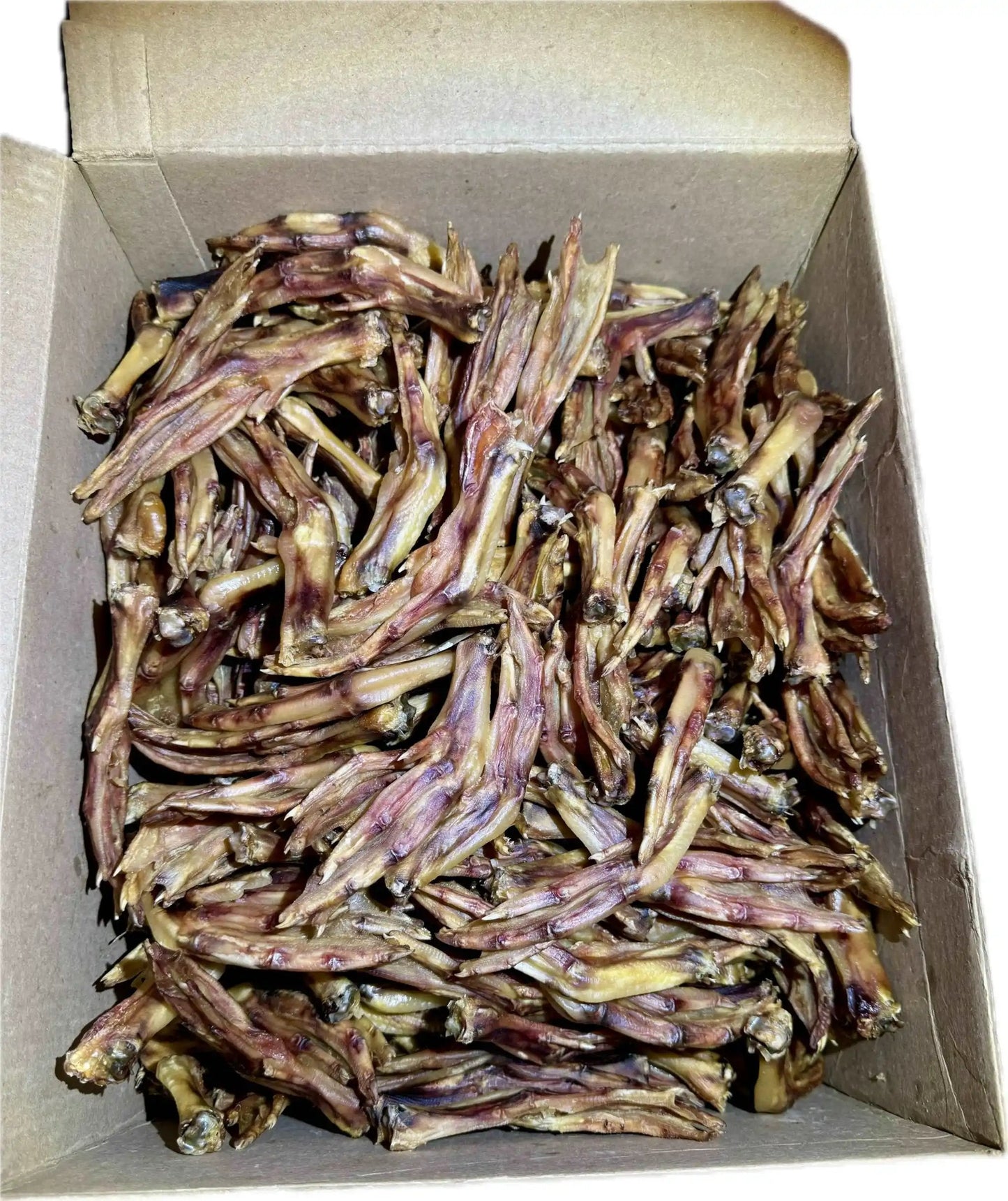 10 lb case of dried duck feet in open box, natural crunchy chews for dogs.