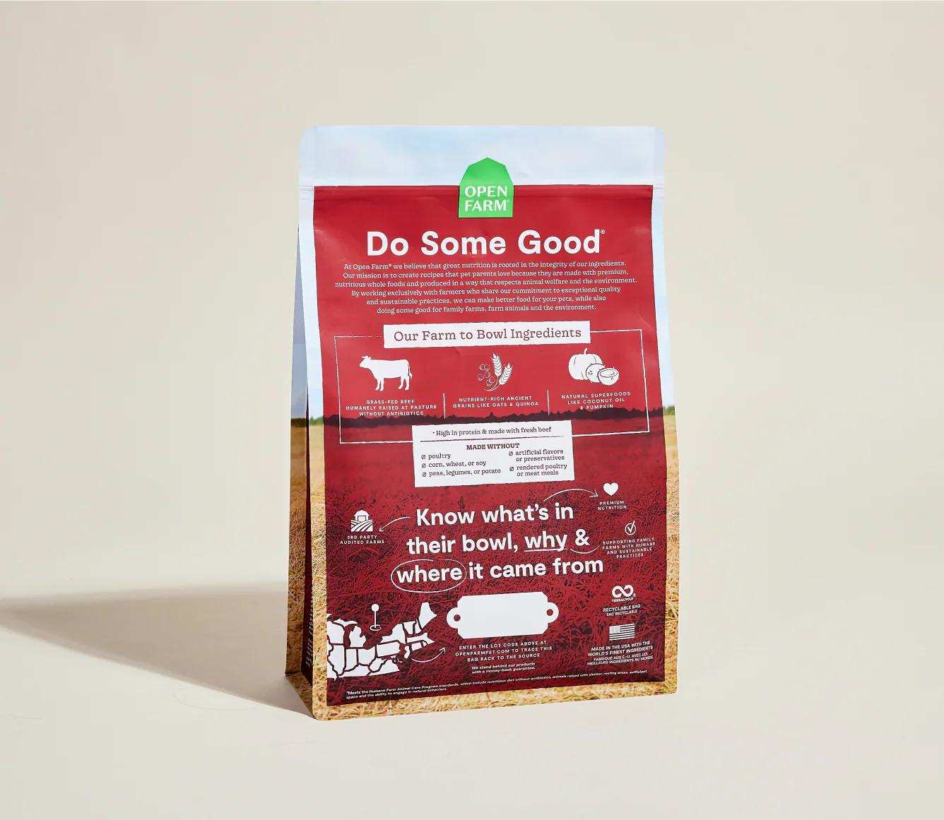 Open Farm Grass-Fed Beef & Ancient Grains Dog Kibble bag with nutrition and sourcing details on red and tan packaging