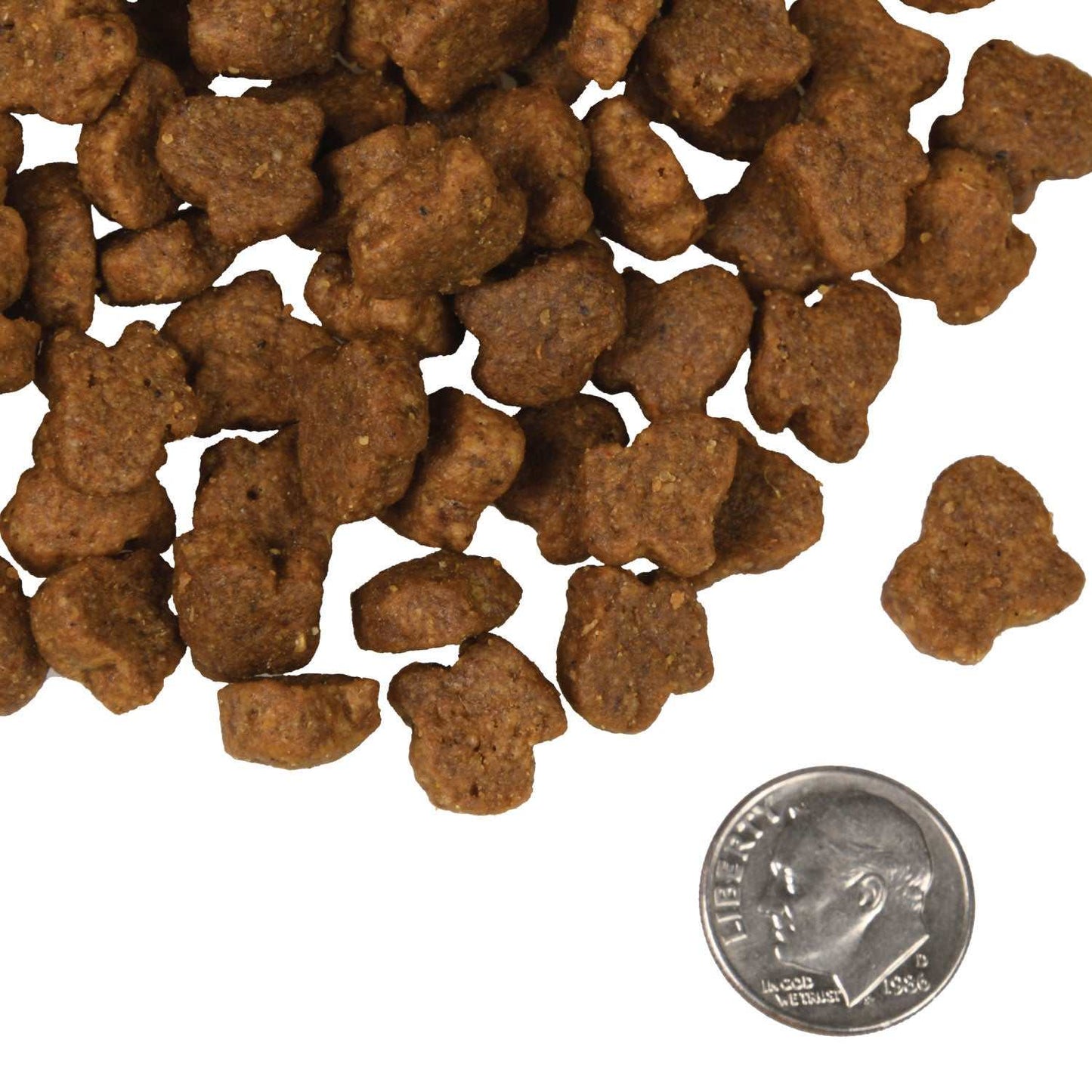 Hasen Duckenpfeffer small brown pet food kibbles with a dime for size comparison