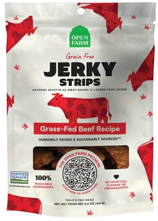 Jerky Strips dog treat pouch in white with red cow illustrations, green logo, and bold grass-fed beef recipe label
