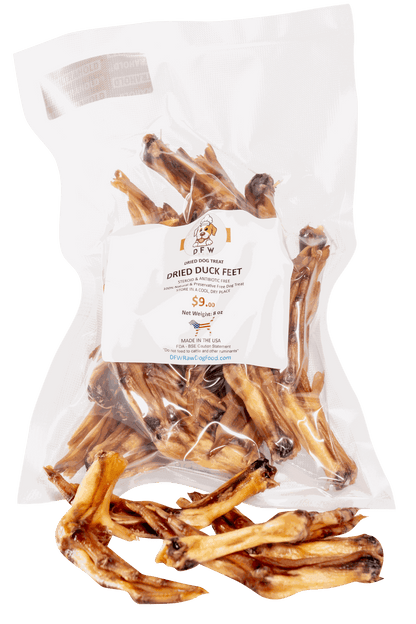 Natural dried duck feet dog chews in a clear packaging, ideal for dental health and small to medium breeds.
