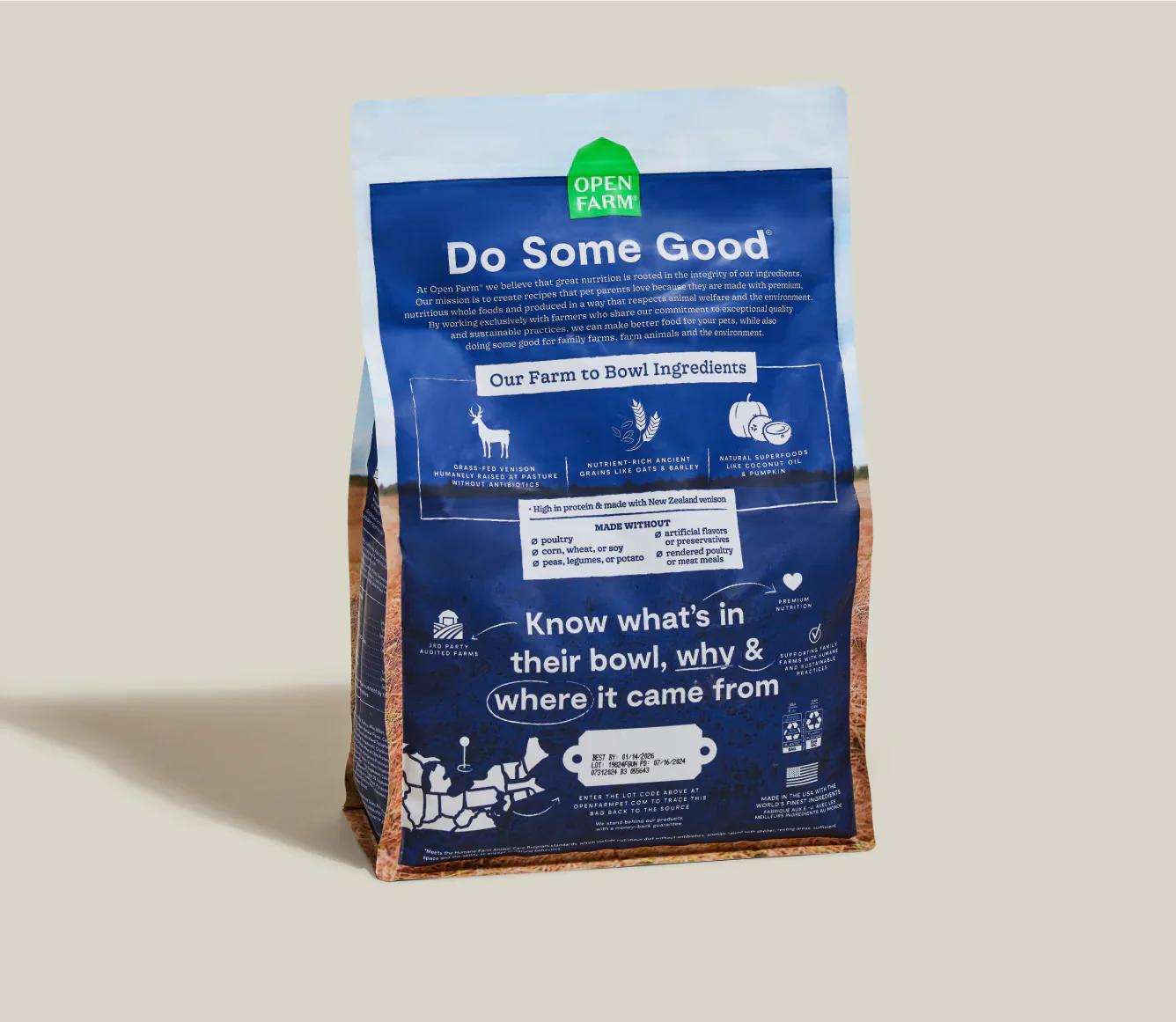 Blue bag of New Zealand Venison & Ancient Grains dog kibble with farm-to-bowl ingredient details and nutritional benefits on the back.