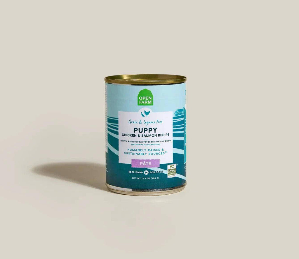 Canned Puppy Chicken & Salmon Pâté with blue and teal label, gold metal lid, and Open Farm branding.