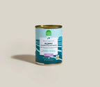 Canned Puppy Chicken & Salmon Pâté with blue and teal label, gold metal lid, and Open Farm branding.