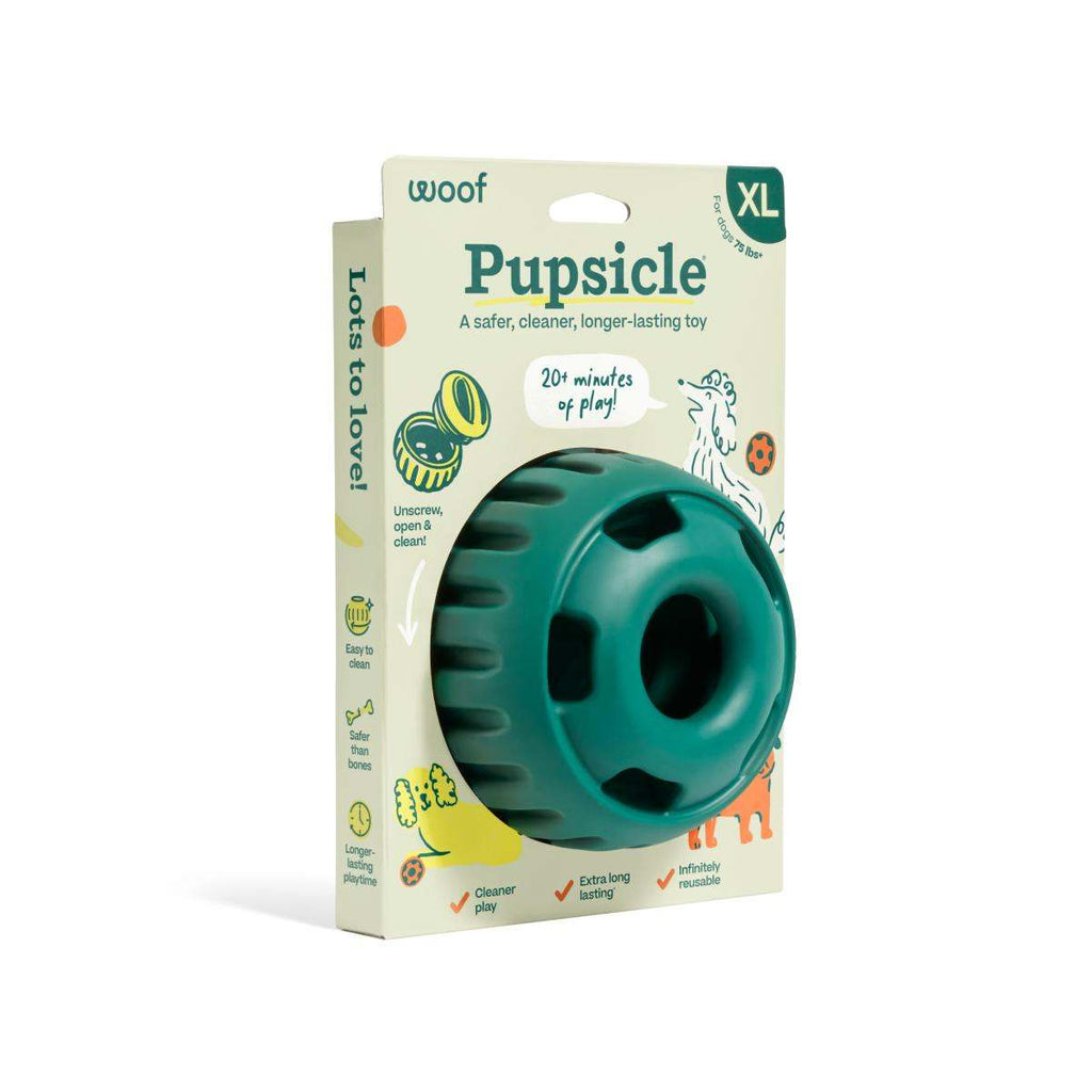 Pupsicle dog enrichment toy made from teal natural rubber, with a rounded ball shape, treat slots and textured sides.
