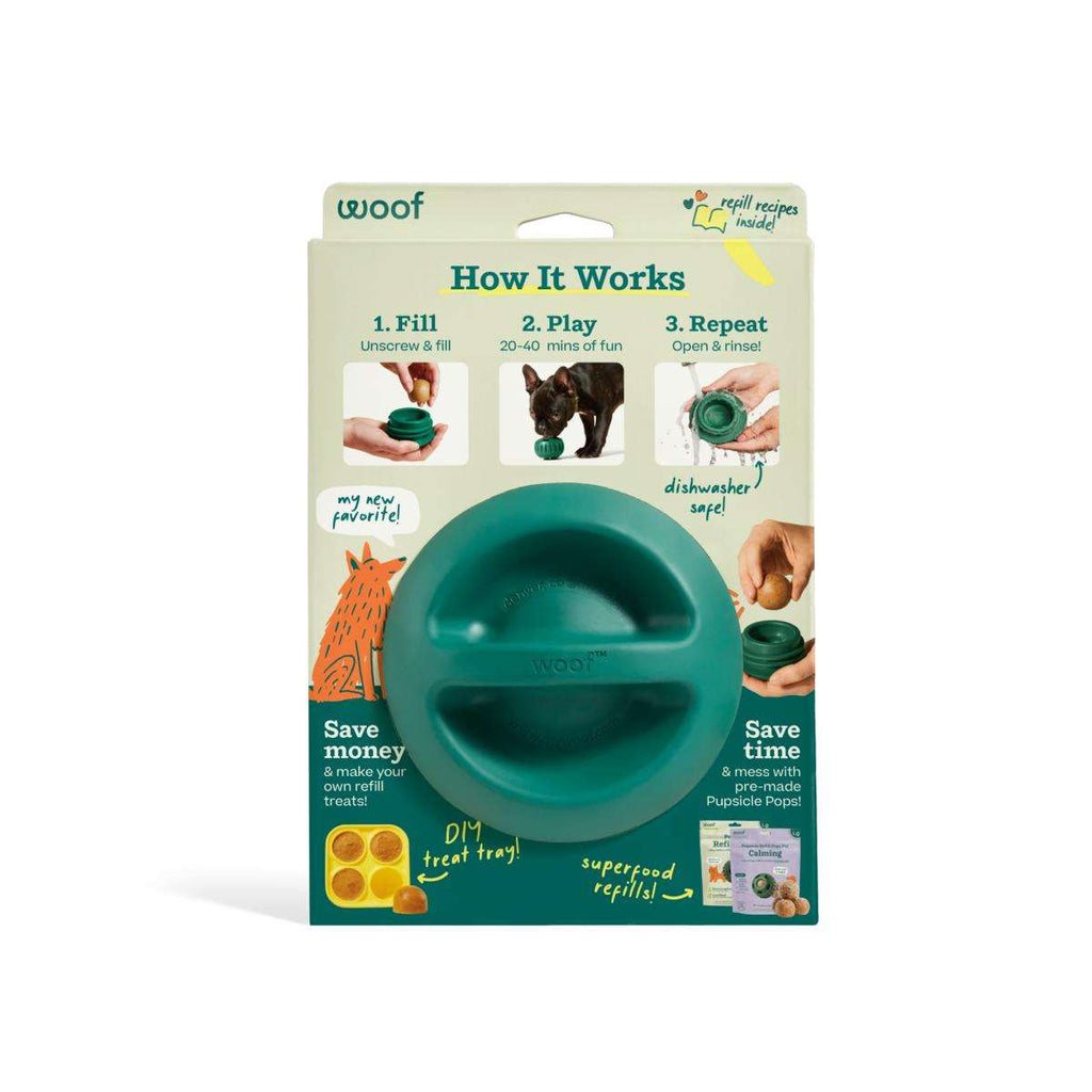 Pupsicle dog enrichment toy in teal natural rubber, shown as a rounded two-piece design with a central treat opening.
