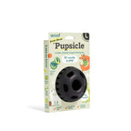 Pupsicle dog enrichment toy with a black, rounded rubber body and central treat opening, packaged in a colorful box.