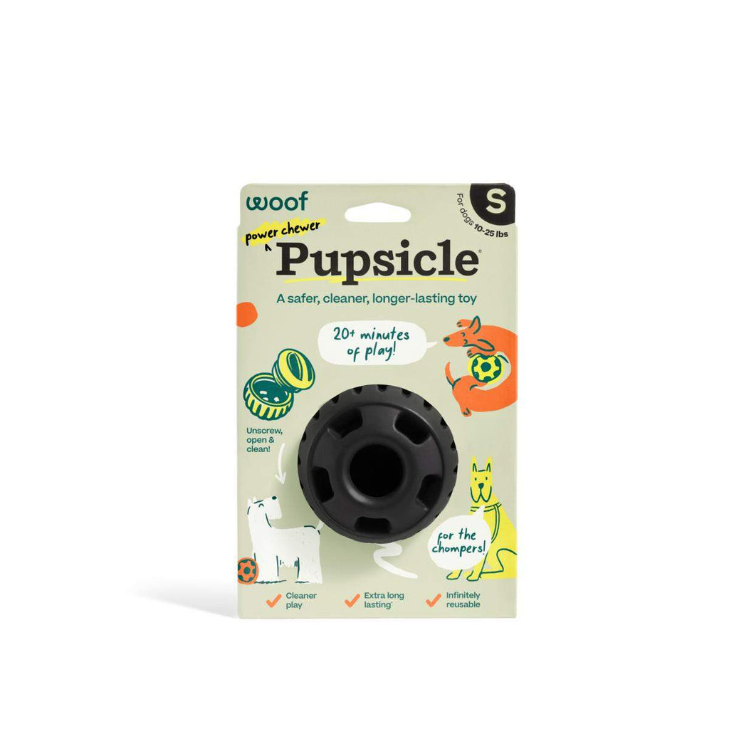 Pupsicle dog enrichment toy, black rubber with a round opening and ridged outer ring, in size small packaging.