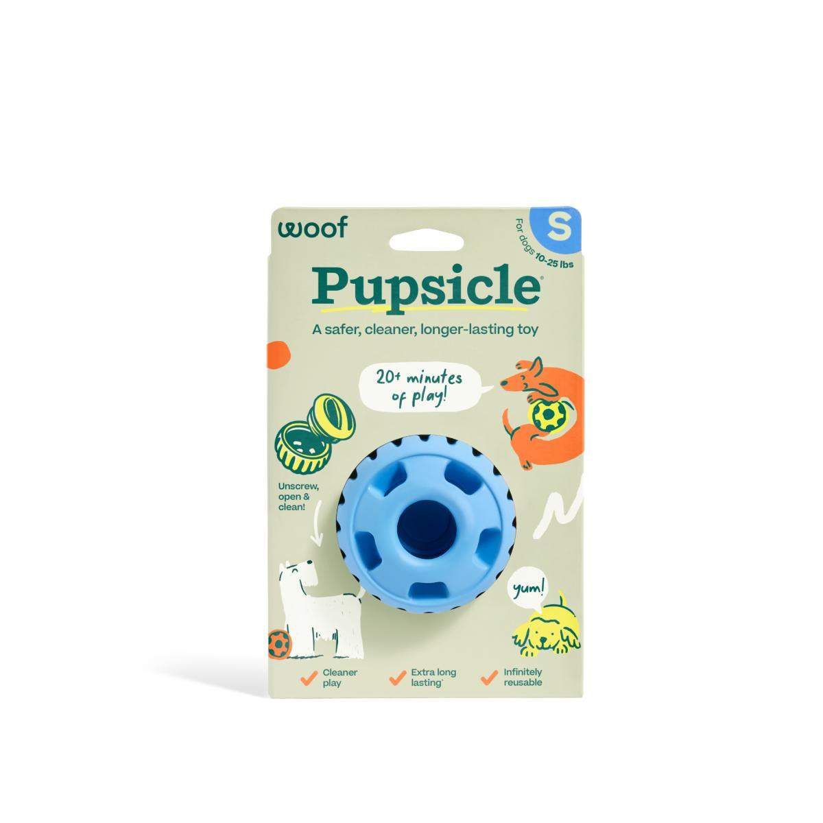 Pupsicle dog enrichment toy in blue rubber, with a round, ridged treat-dispensing design on retail packaging.