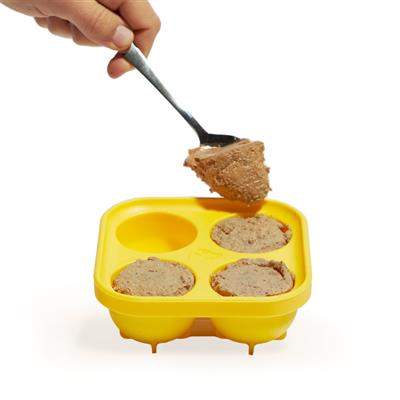 Pupsicle Treat Tray with four molds being filled with dog food.