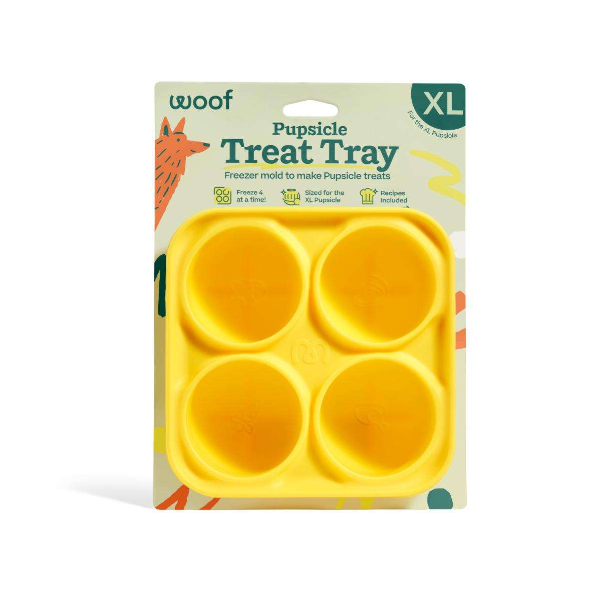 Pupsicle Treat Tray, yellow silicone mold with four round cavities for making frozen dog treats, on retail packaging.