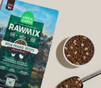 RawMix Open Prairie ancient grains dog kibble in a green bag, with brown kibble and freeze-dried raw pieces in a bowl.