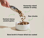 RawMix Open Prairie dog kibble with brown ancient-grain pieces and larger freeze-dried raw chunks coated in bone broth.