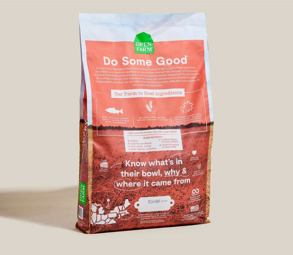 Puppy food kibble in a red and white Open Farm bag, with salmon and ancient grains; Puppy Salmon & Ancient Grain Recipe.