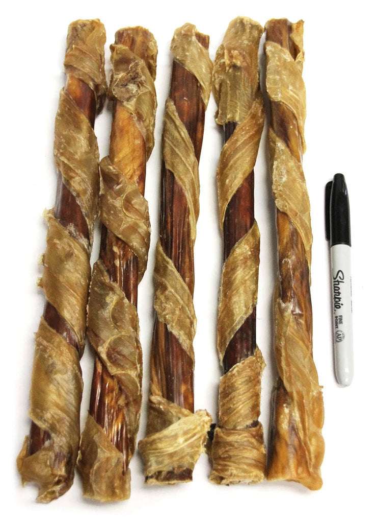 Tremenda Chewy Bulls durable beef dog treats wrapped in dehydrated beef bladder next to a marker for size comparison