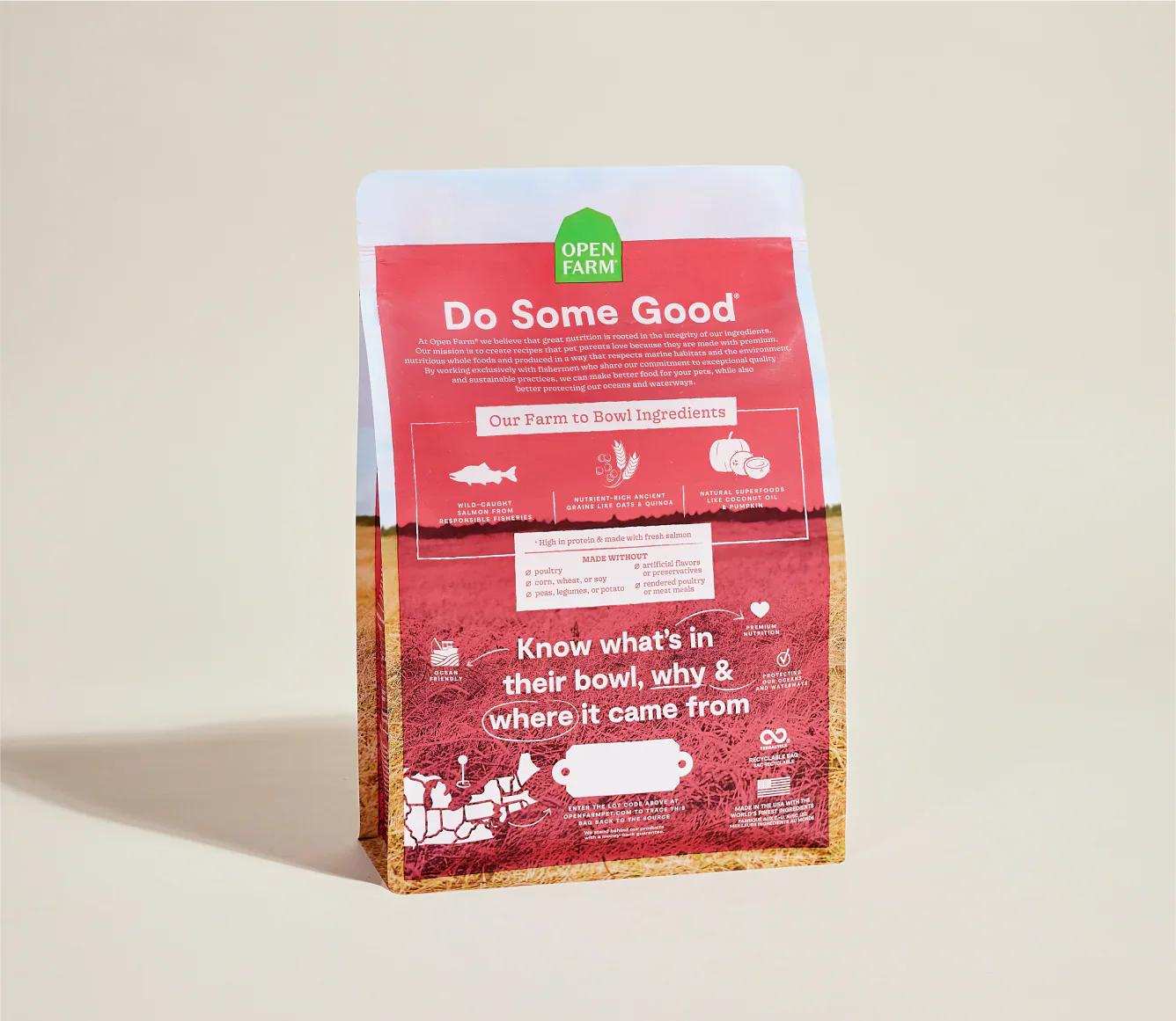 Wild-Caught Salmon & Ancient Grain Recipe dog kibble bag with nutrition and ingredient details on red and white packaging