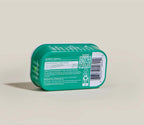 Arctic Char Topper for Dogs in a teal-green plastic tub with white labeling, QR code and barcode on the back.