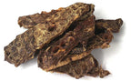 Beef Lung Wafers, irregular dark brown dried meat pieces with a rough, porous, brittle-looking texture.