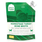 Bone Broth in a green, resealable pouch with white label, turkey illustration, and Homestead Turkey flavor text.