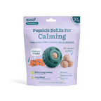 Calming Vitamin Pops appear as lavender refill packaging with teal text, a teal toy and tan round treats pictured.
