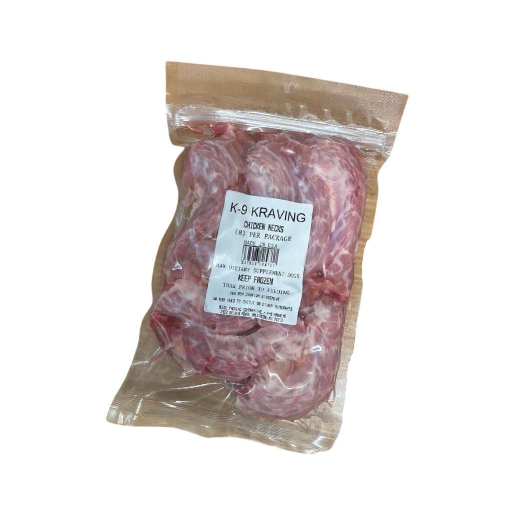 Chicken Necks in a clear plastic sealed bag, showing pink raw meat and pale bone pieces with a printed label.