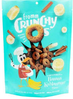 Dog treat bag for Banana Kablammas, turquoise packaging with playful cartoon bird and crunchy brown ring-shaped treats, banana and cinnamon graphics.