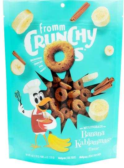 Dog treat bag for Banana Kablammas, turquoise packaging with playful cartoon bird and crunchy brown ring-shaped treats, banana and cinnamon graphics.