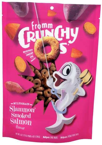 Crunchy O's Slammon dog treats in a bright pink resealable bag with smoked salmon and sweet potato illustrations.