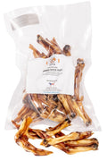 Dried Duck Feet, golden-brown air-dried chews with curled toes, packaged in a clear plastic bag with a white label.