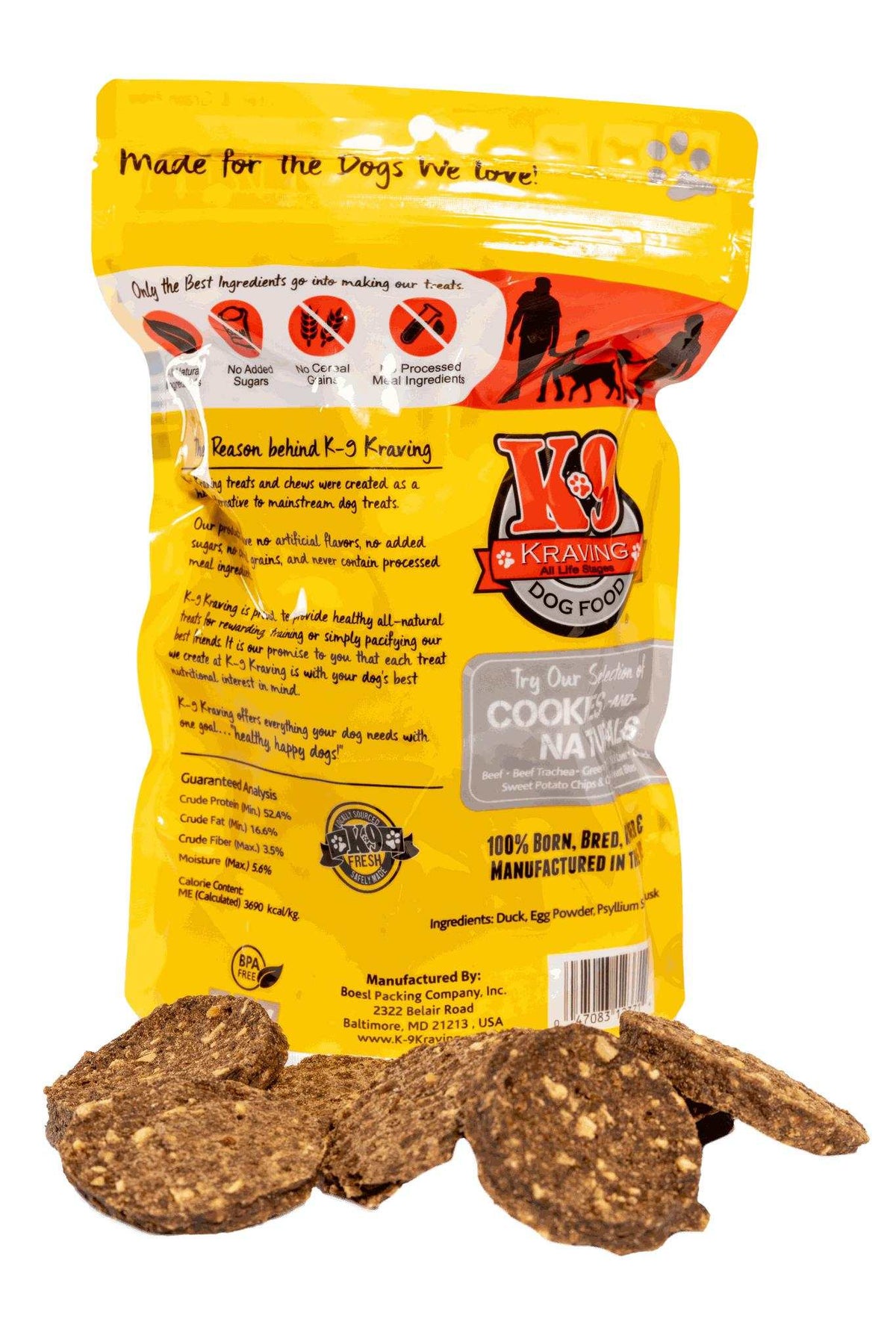 Dog treats in a bright yellow duck-print package with brown, irregular crunchy cookies visible in front, labeled Duck K-9 Cookies