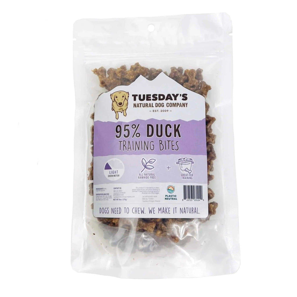Duck Training Bites in a clear resealable pouch, showing brown bite-sized treats and a purple-and-white label.
