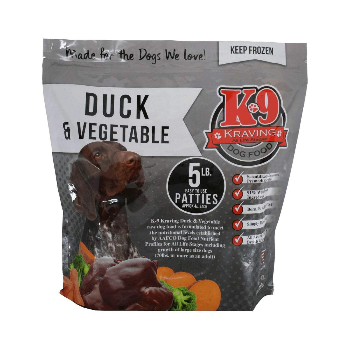 Dog food package for Duck & Vegetable frozen raw patties, in a gray bag with red and white branding and food imagery.