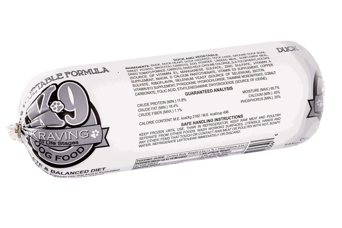 Duck dog food roll in white plastic packaging with black and purple branding, printed K-9 logo, and ingredient label