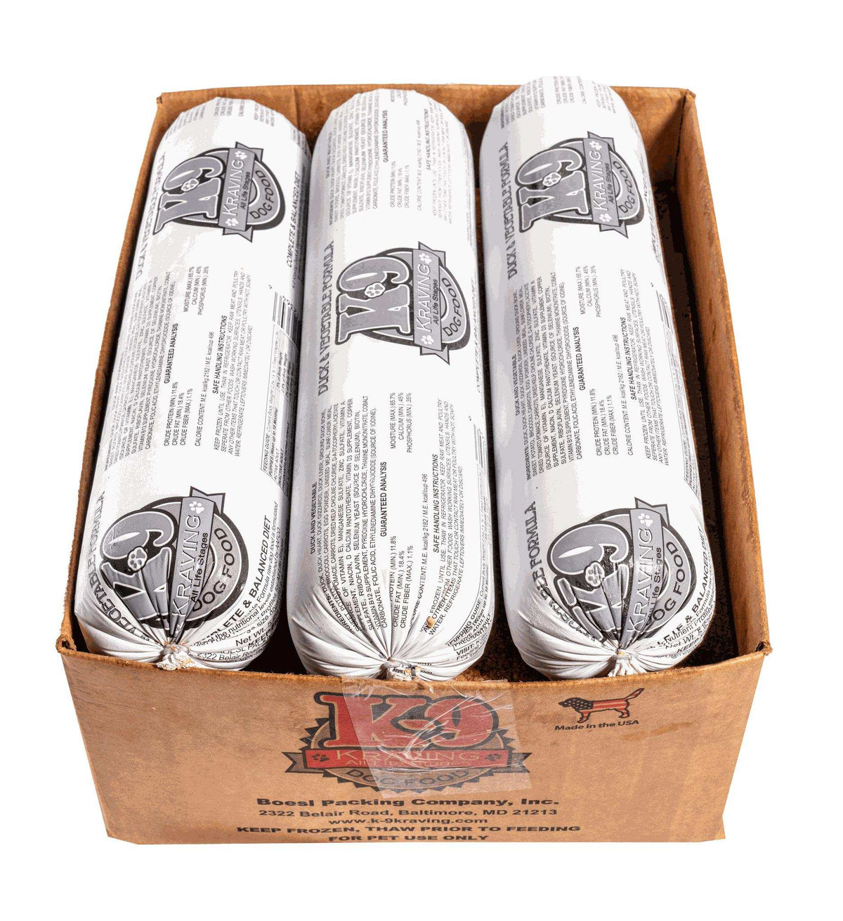 Duck dog food rolls in white printed casings, packed three per brown cardboard box with K-9 Kraving branding.