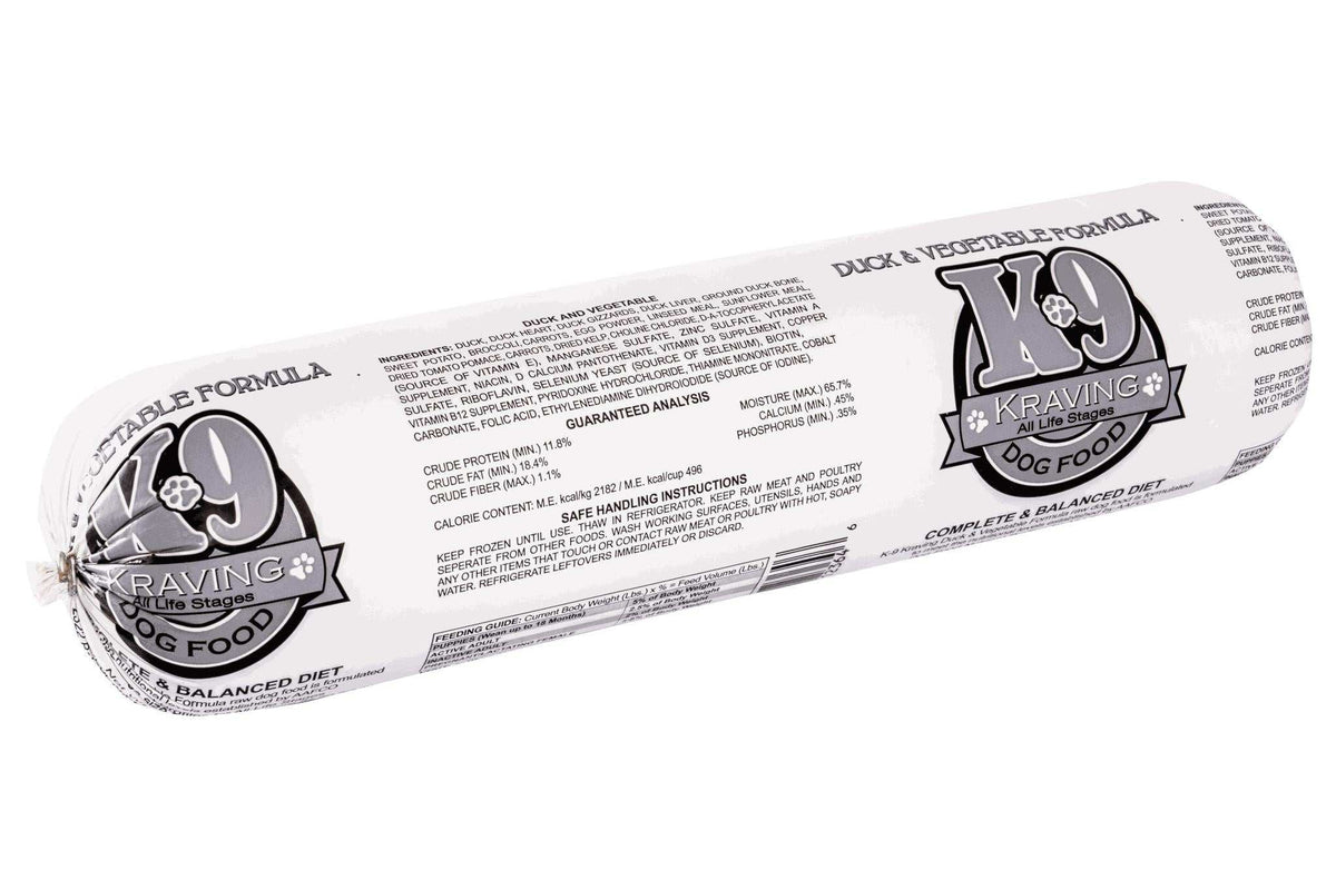 Frozen raw Duck dog food in a white plastic tube with bold black-and-gray K-9 Kraving labels and printed product details.