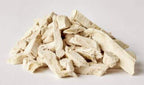 Freeze dried rabbit tenders piled on white background.
