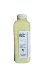 Bottle of fresh raw goat milk from locally sourced farms.