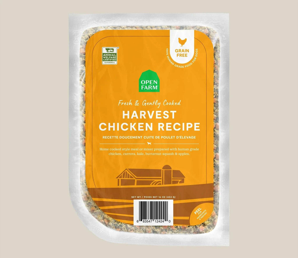 Harvest Chicken Grain-Free dog food in a sealed clear pouch, with an orange label and gently cooked chicken recipe.