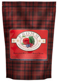 Dog food bag with red and black tartan pattern featuring a red label with fruit and vegetable illustration for Four-Star Beef Oats & Barley recipe.