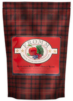 Dog food bag with red and black tartan pattern featuring a red label with fruit and vegetable illustration for Four-Star Beef Oats & Barley recipe.