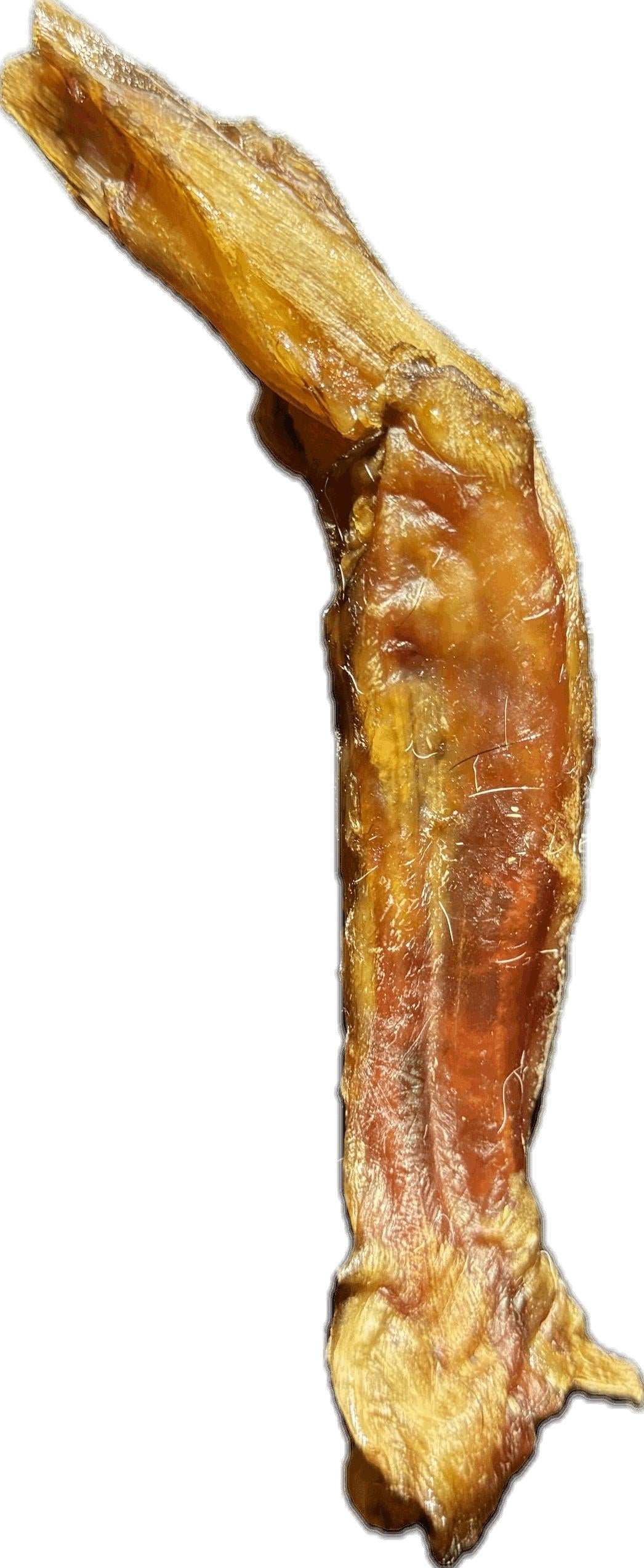 Jr. Chews dried beef tendon, golden-brown and fibrous with a naturally twisted, irregular shape.
