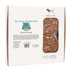 Mackerel and vegetable raw dog food in a white cardboard box, with a clear window showing frozen brown patties.