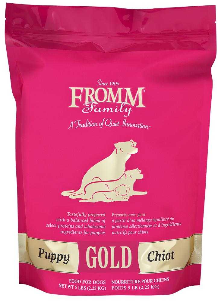 Fromm Puppy Gold Dog Food in a pink bag with gold accents and a puppy illustration.